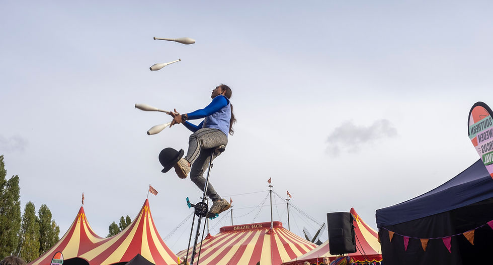 Carlos Lopez juggles clubs on a unicycle as part of the Southern Sweden Circus Festival 2024 in Malmö