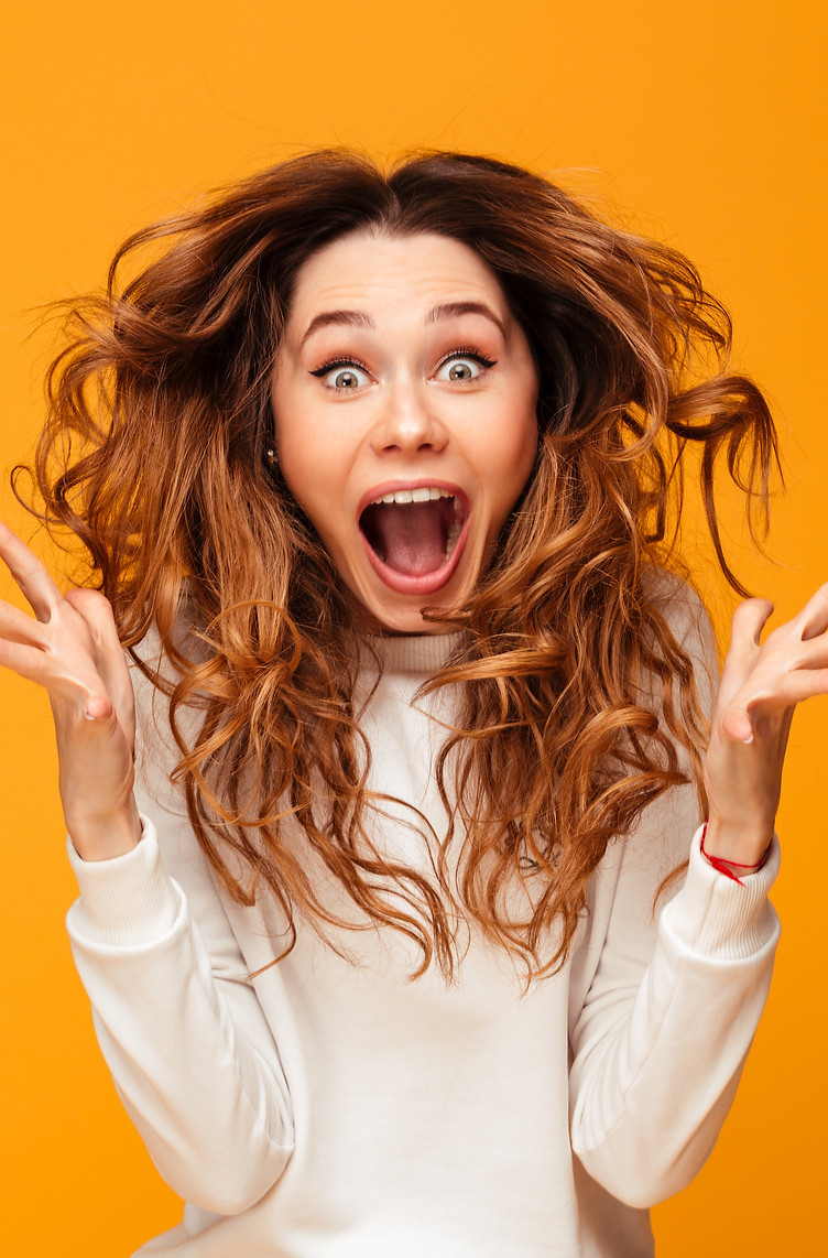 woman exited  with orange background 