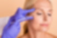 older woman getting injected on the face with wrinkle relaxer product to smooth out fine lines