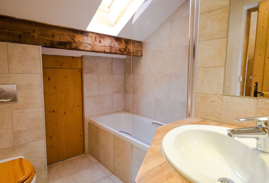 Natural stone tiled ensuites.jpg