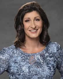 Photo of Melody Sandberg-McDonald in a business light blue shirt