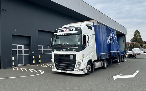 Curtain-sided trailer with extended height for loading