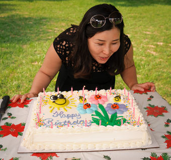 Yun blows out candles on her birtday cake (BBQ, 2018)