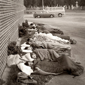 Members of Optimists resting after the long drive to Madison (Madison, 1970)