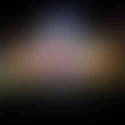 Christmas display at Gull Lake’s Christmas Cove 2023 featuring a seated Santa under a lighted archway, surrounded by illuminated trees. A sign in front reads “Senior Citizen’s.”