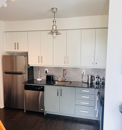 AFTER image (Two-tone kitchen cabinets after professional spray refinishing)