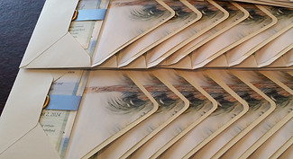 Invitation suites with envelope liners stacked after assembly