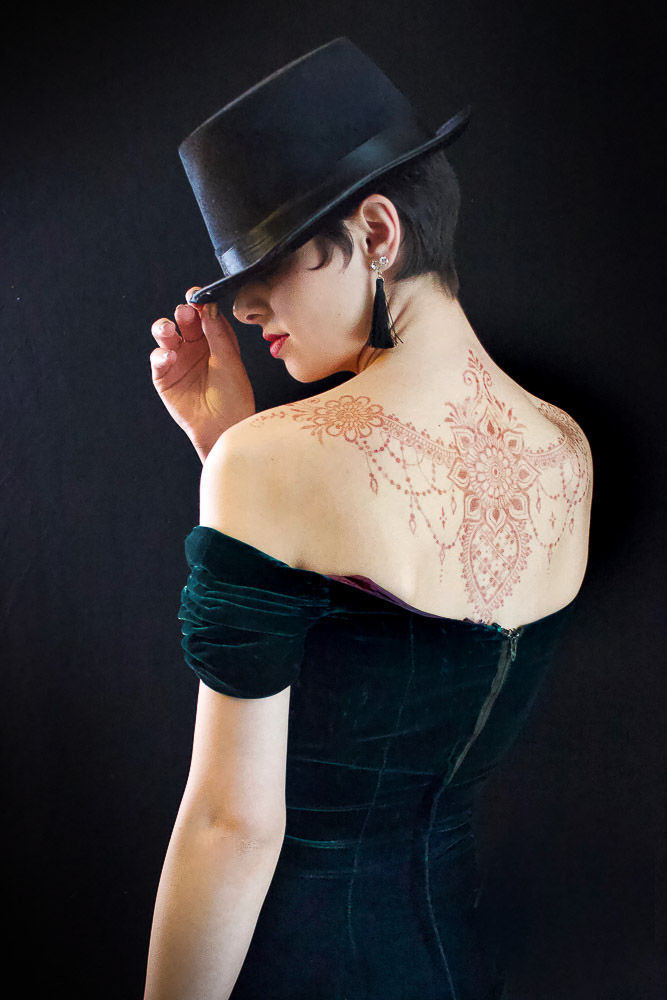 Henna on a back with top hat.