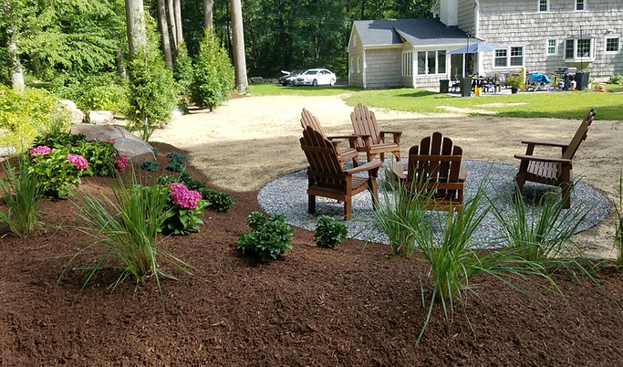 landscape design and construction. fire pit seating area. plantings. tree installation.