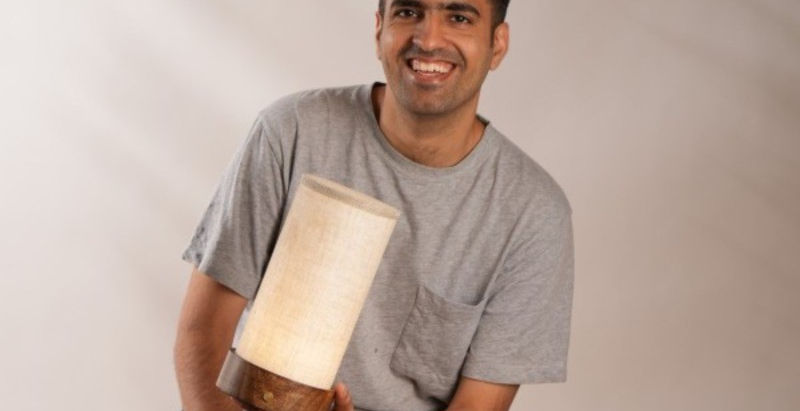 Minimalist interior featuring FIG Living’s sculptural Tyvek lighting, soft textiles, and ambient illumination creating a warm, modern living space.