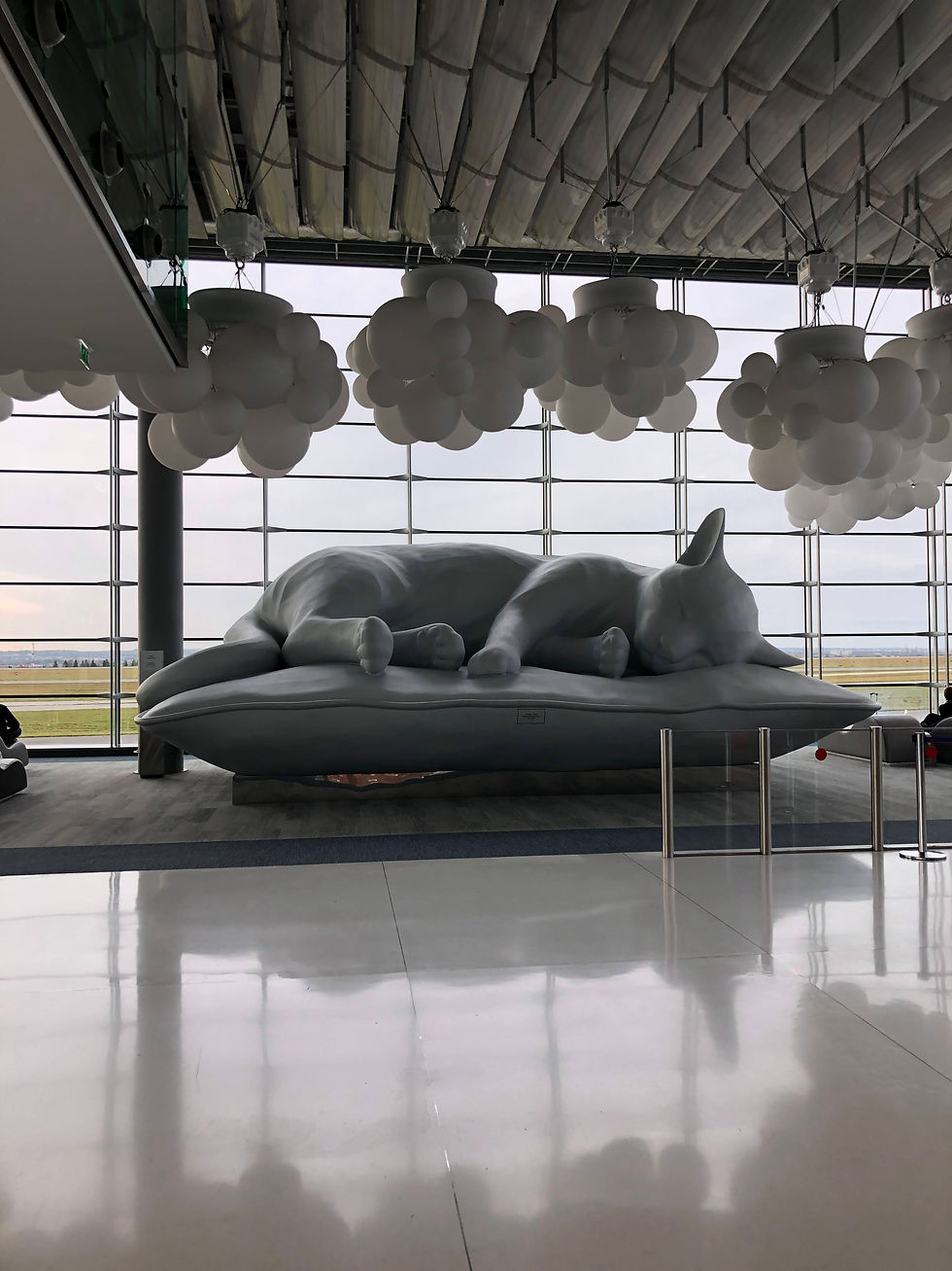 A sculpture of a cat in the Paris Airport