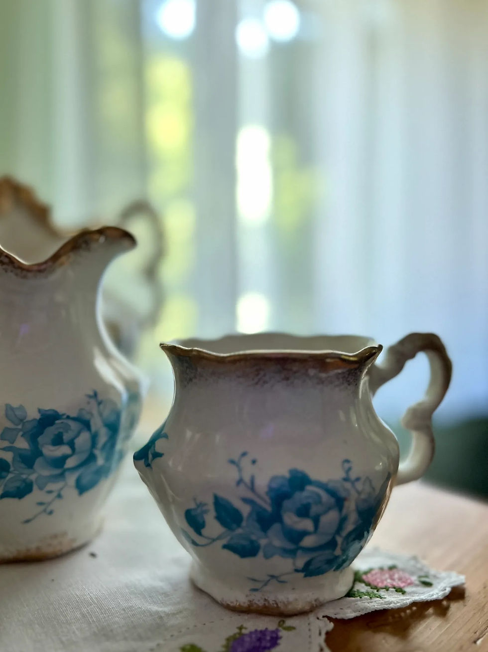 Floral porcelain pitcher set on display at Kinsley House Museum