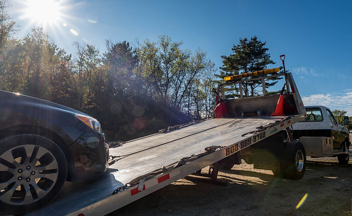 Car being loaded on tow truck