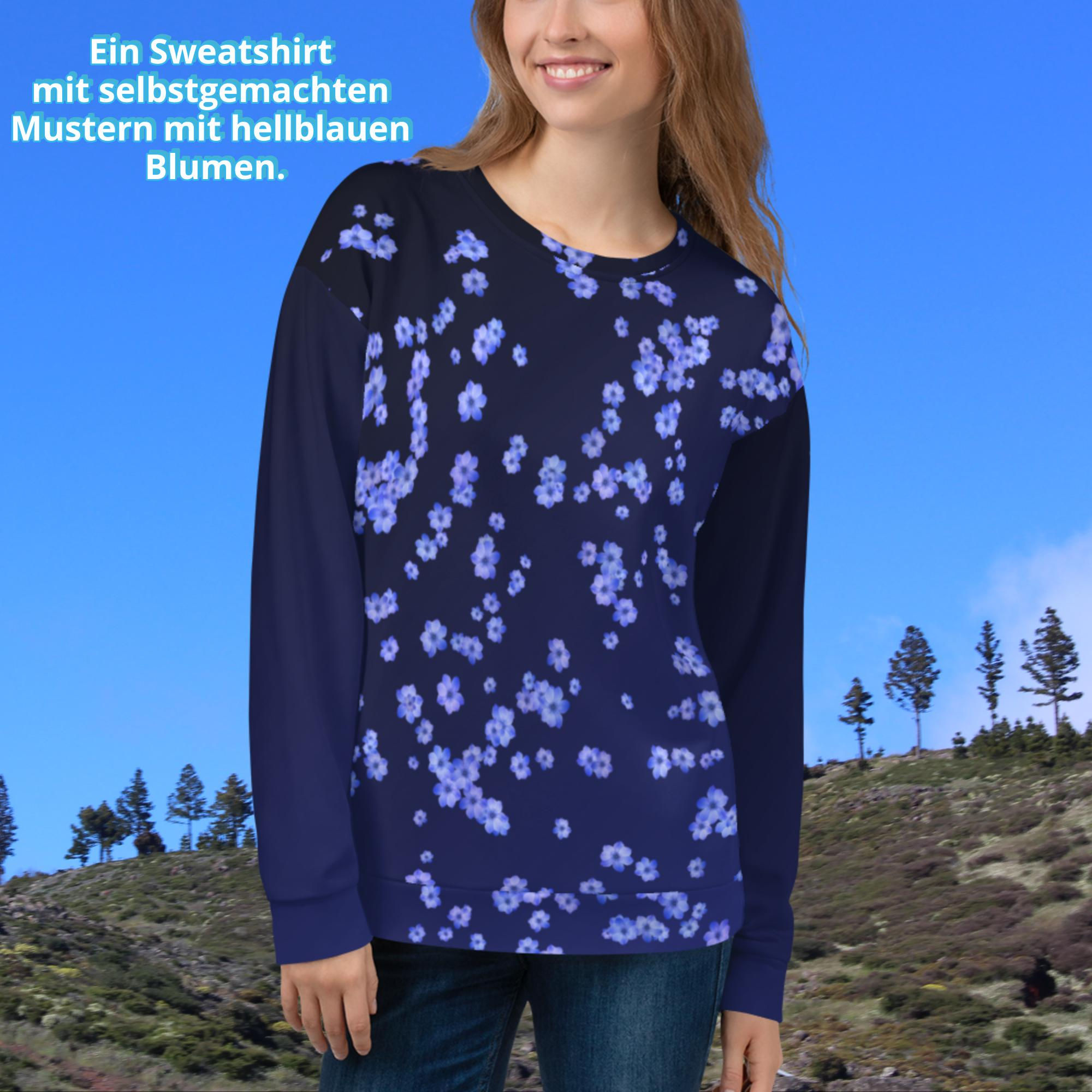 Ein Sweatshirt mit selbstgemachten Mustern mit hellblauen Blumen.