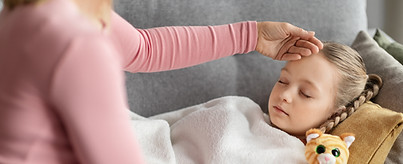 loving-mom-touching-forehead-of-her-sleeping-sick-2025-03-18-16-54-10-utc.jpg
