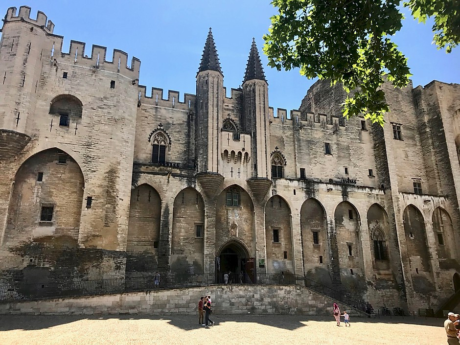 the imposing Gothic facade of the pope's Palace in Avignon
