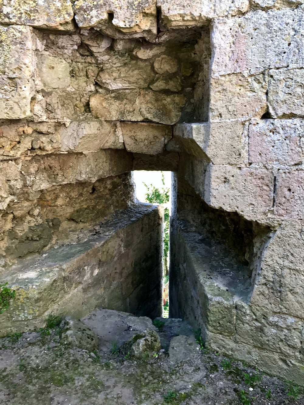 a slit for arrows to pummel invaders