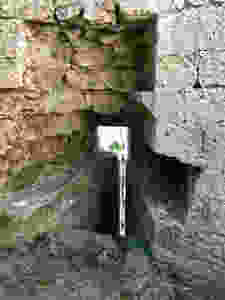 a slit for arrows to pummel invaders