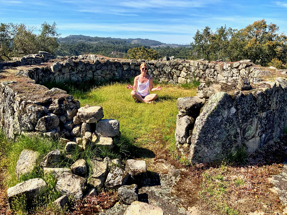 Ali resting in the ruins of Citania de Briteiros, an ancient fortified town near Guimaraes. We both got carsick driving up the curly roads to the mountaintop.