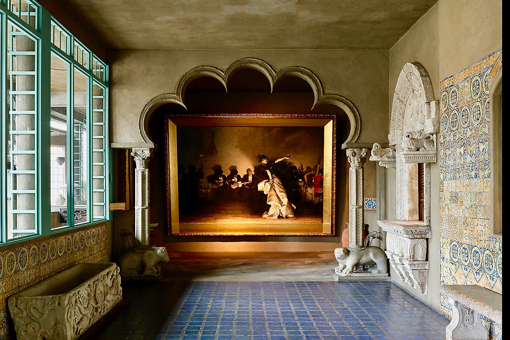 John Singer Sargent's El Jaleo in the Spanish Cloister, framed by Moorish arches