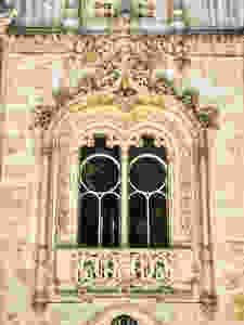an ornately carved Neo-Manueline style window on the exterior