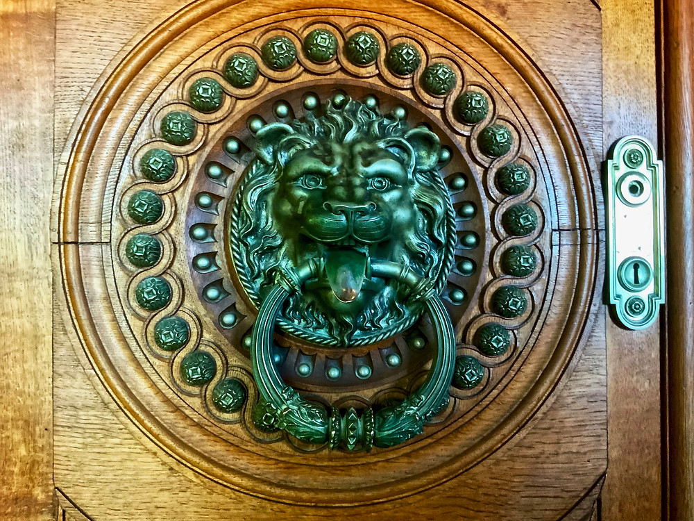 an iron door door knocker in the Palace of Quinta da Regaleira