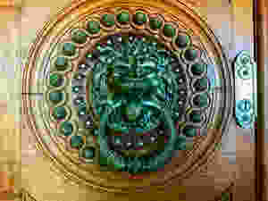 an iron door door knocker in the Palace of Quinta da Regaleira