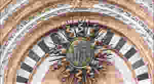 he sunburst in the central portal of the facade of Siena Cathedral