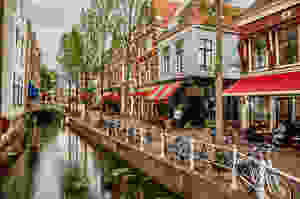 a picturesque canal in Delft in the Netherlands