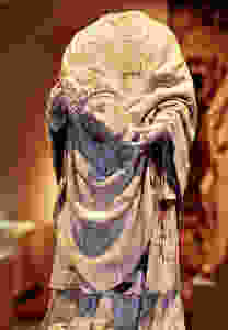 statue of Saint Denis in Paris' Cluny Museum