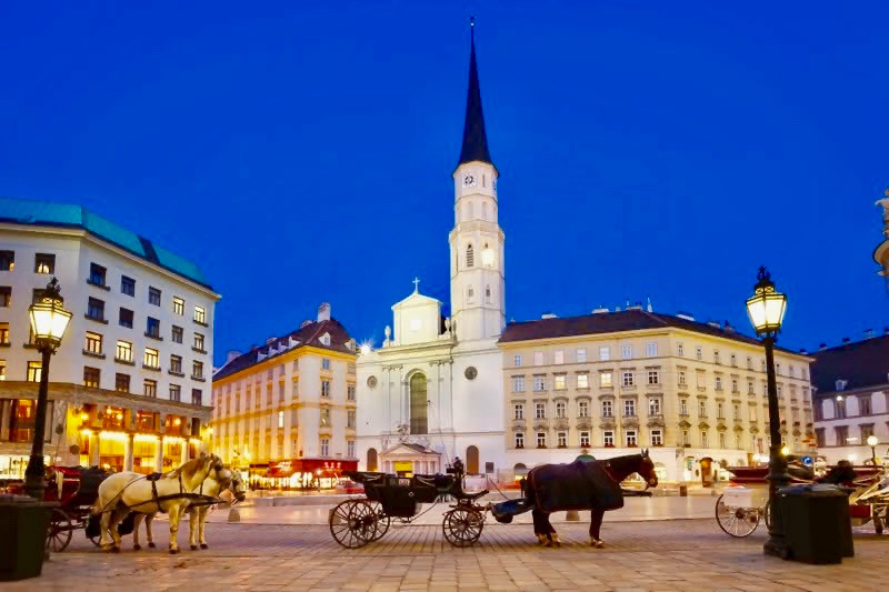 horse drawn carriages in front of St. Michael's Church in St. Michael's Square