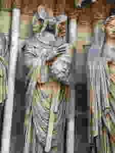 St. Denis holding his head on the facade of Reims Cathedral