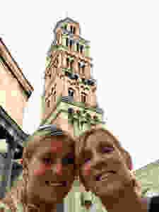 my daughter and I in front of the bell tower in Diocletian's Palace