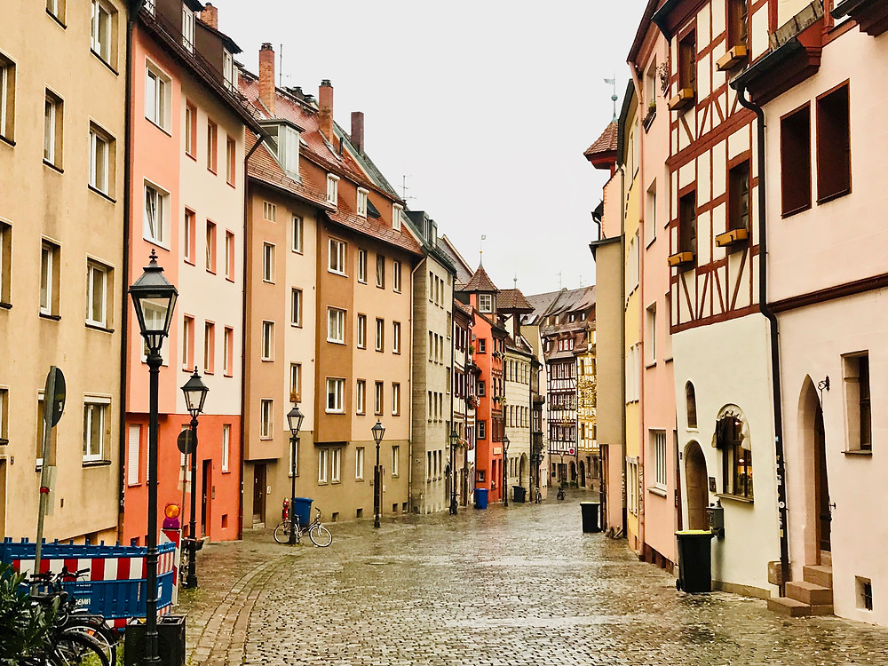 typical cute street with pastel colored houses in Bamberg