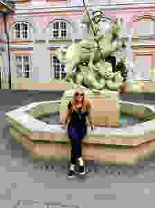 taking a break at the Saint George Fountain in the pretty Primate's Palace courtyard in Bratislava