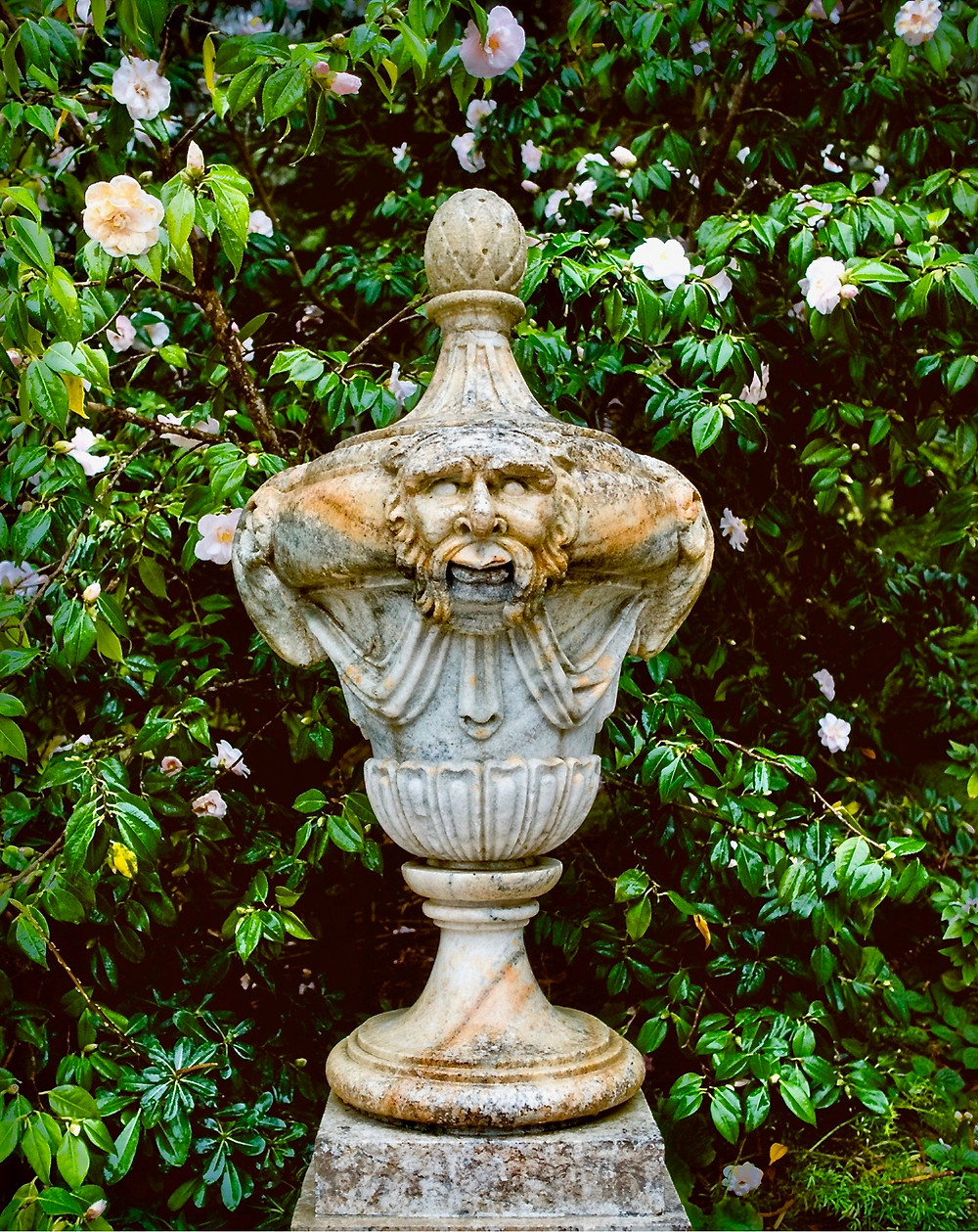 a little sculpture set amid the plantings