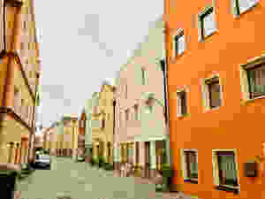 a pretty street with sherbet colored homes in Vilshofen