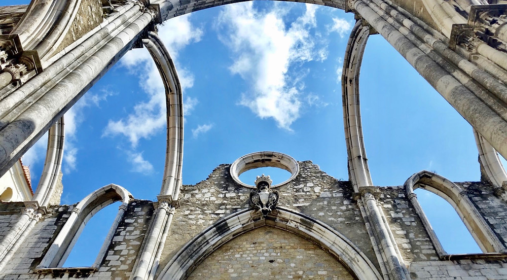 the wishbone-like gothic arches of the Igreja do Carmo set against the blue sky