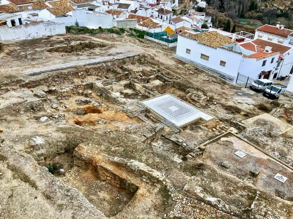 Ruins of 1st century A.D. Roman thermal baths. a well preserved mosaic is covered to protect it from the elements.