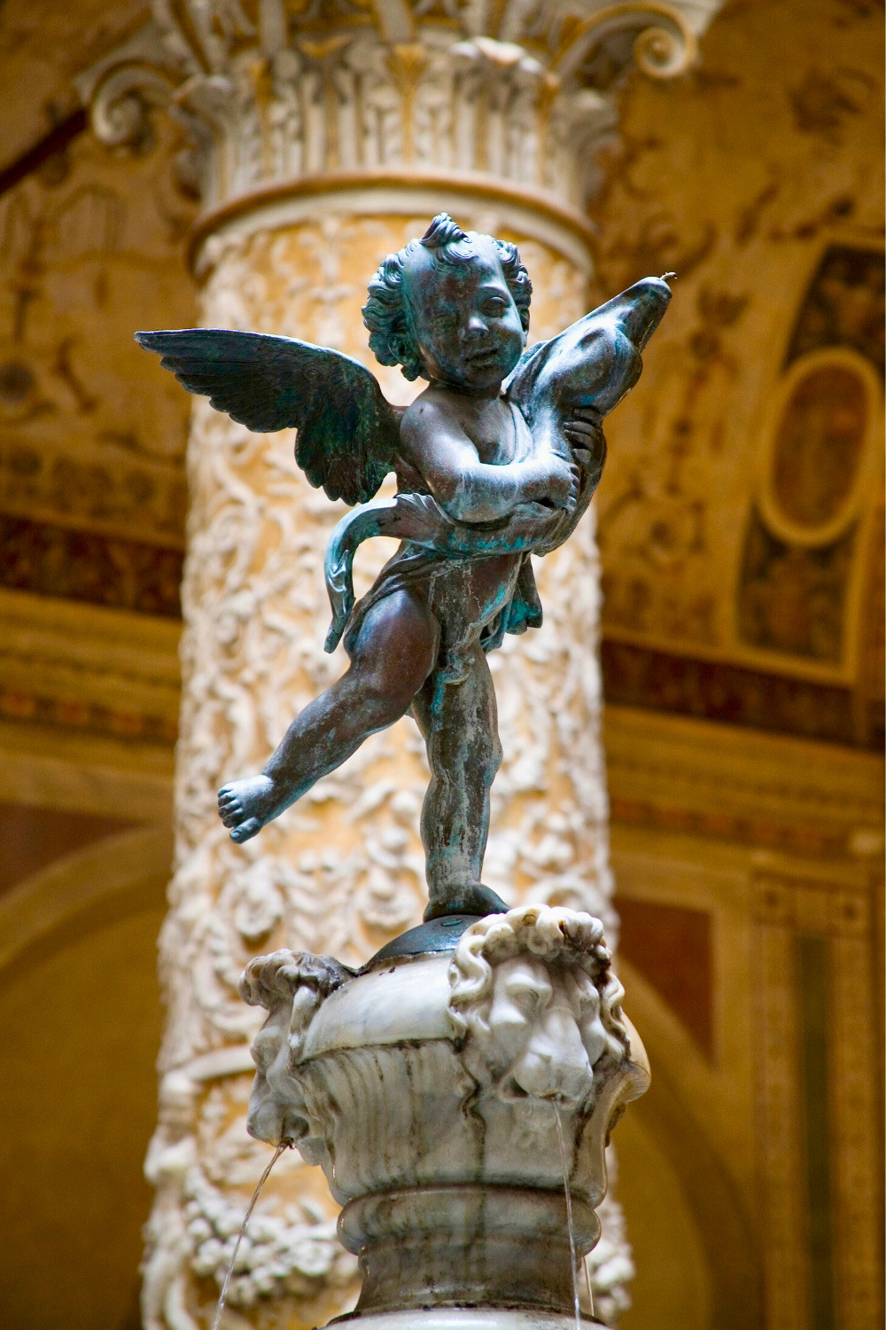 copy of Verrochio's original putti sculpture in the Palazzo Vecchio