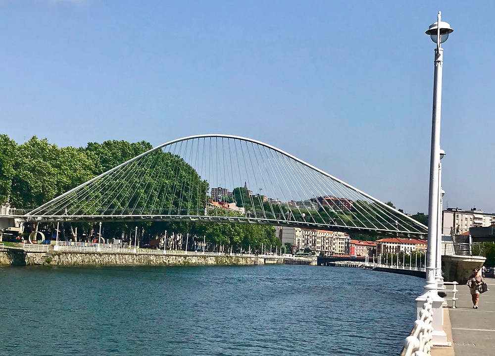 the 1997 glass bottomed Zubizuri Bridge in Bilbao