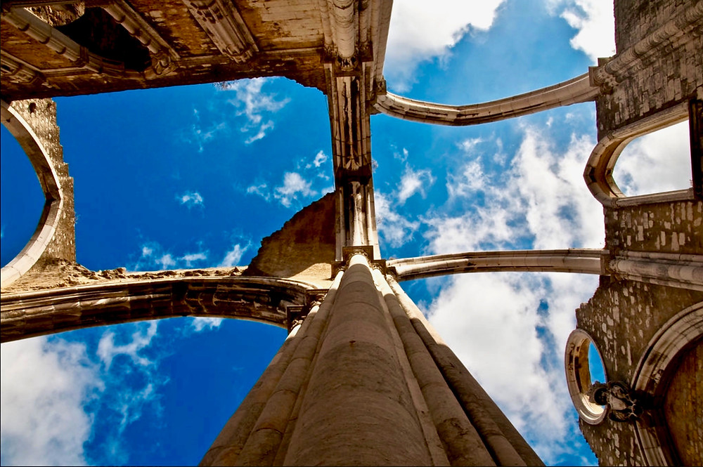 the wishbone-like gothic arches of the Igreja do Carmo set against the blue sky