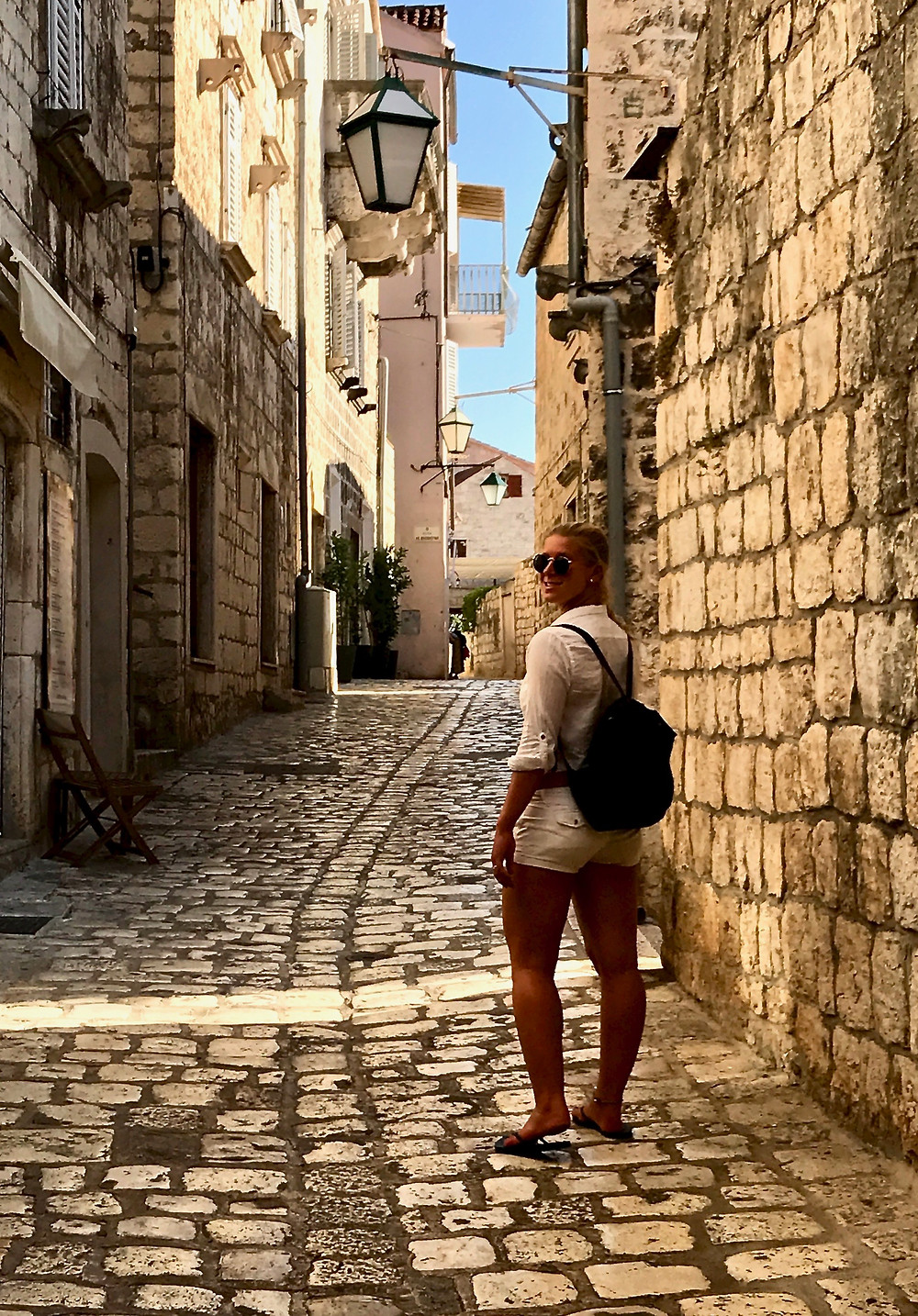 my daughter on the limestone streets of Hvar