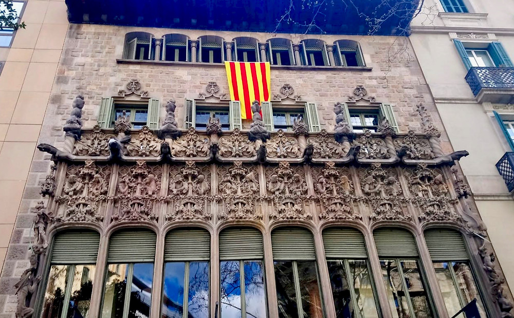 the exuberant Neo-Gothic facade of Palau del Baro de Quadras