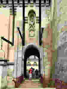 the drawbridge entry with a statue of St. George slaying the dragon at the top
