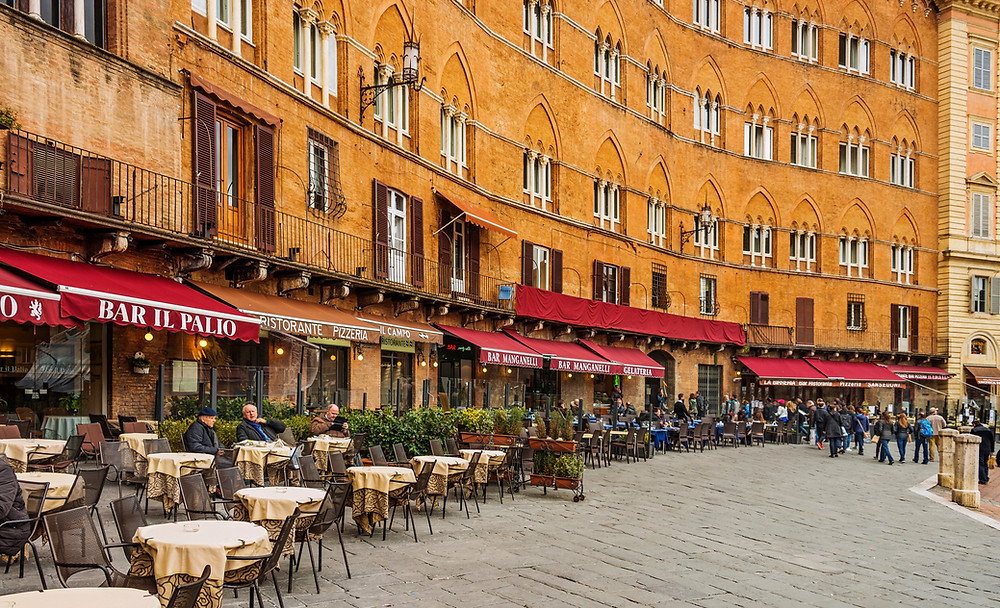 cafes lining the medieval Piazza del Campo in Siena