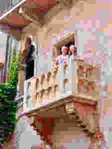 my daughter and a friend enjoying Juliet's balcony in fair Verona