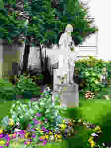 statue of Voltaire at the Institute de France