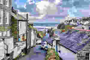 tiny streets of Port Isaac with the Atlantic Ocean crashing in the background