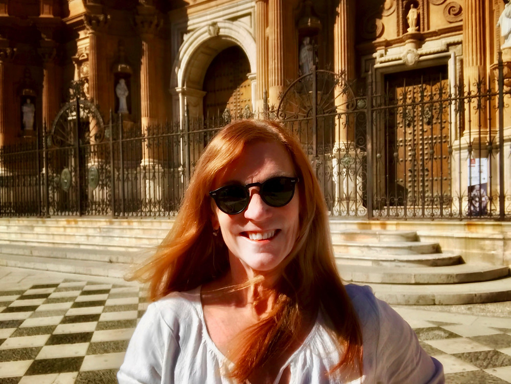on the steps of the impressive Guadix Cathedral in Andalusia